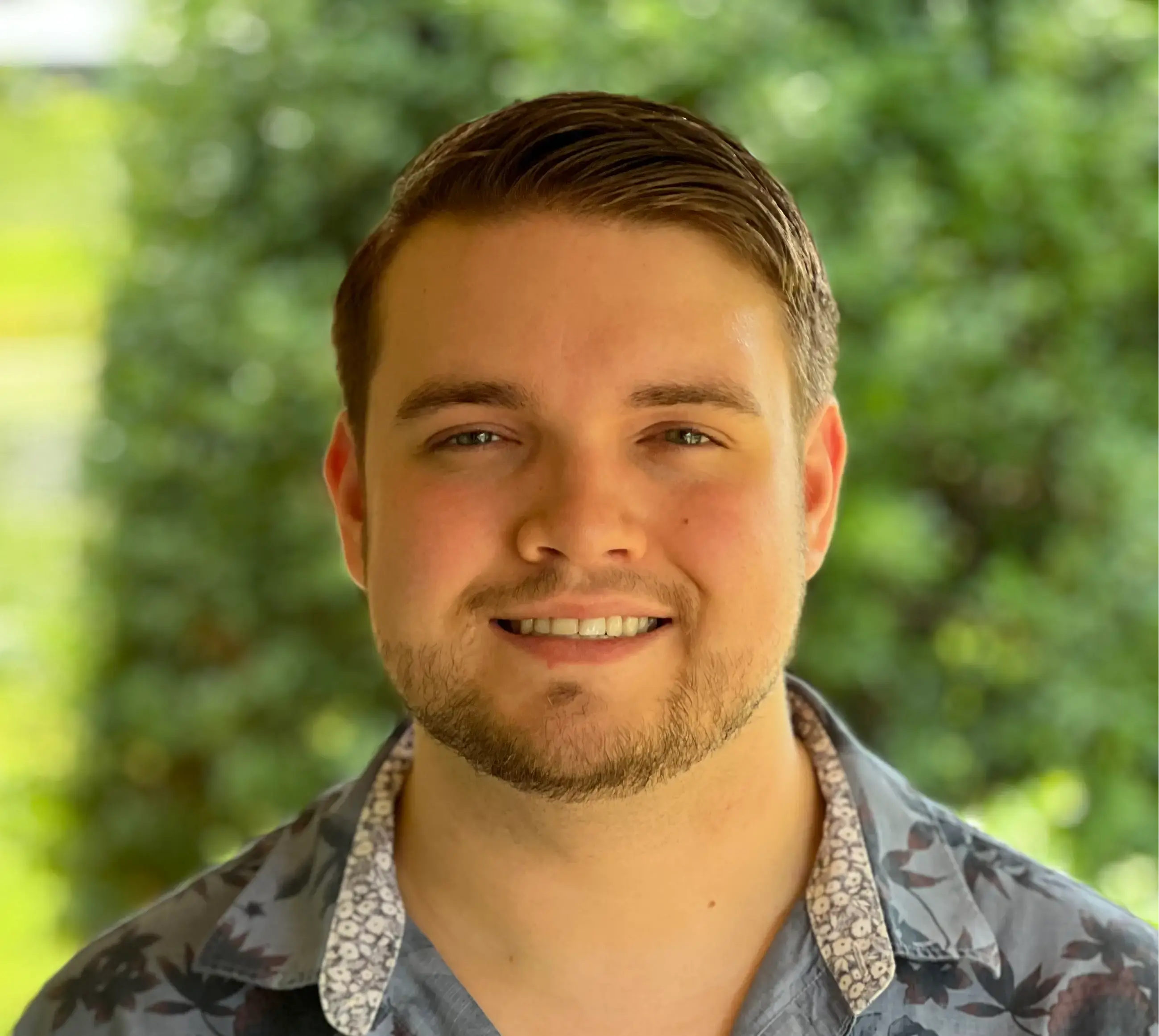 Professional headshot of Kainen White, Product & UX Designer